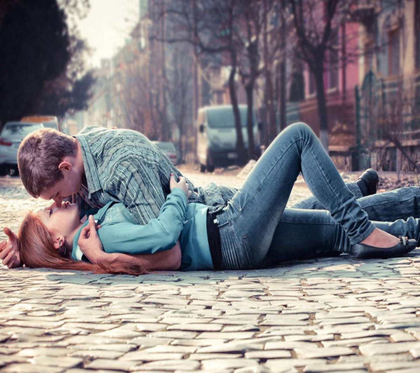 Cute Couple Kissing On Road Wallpaper