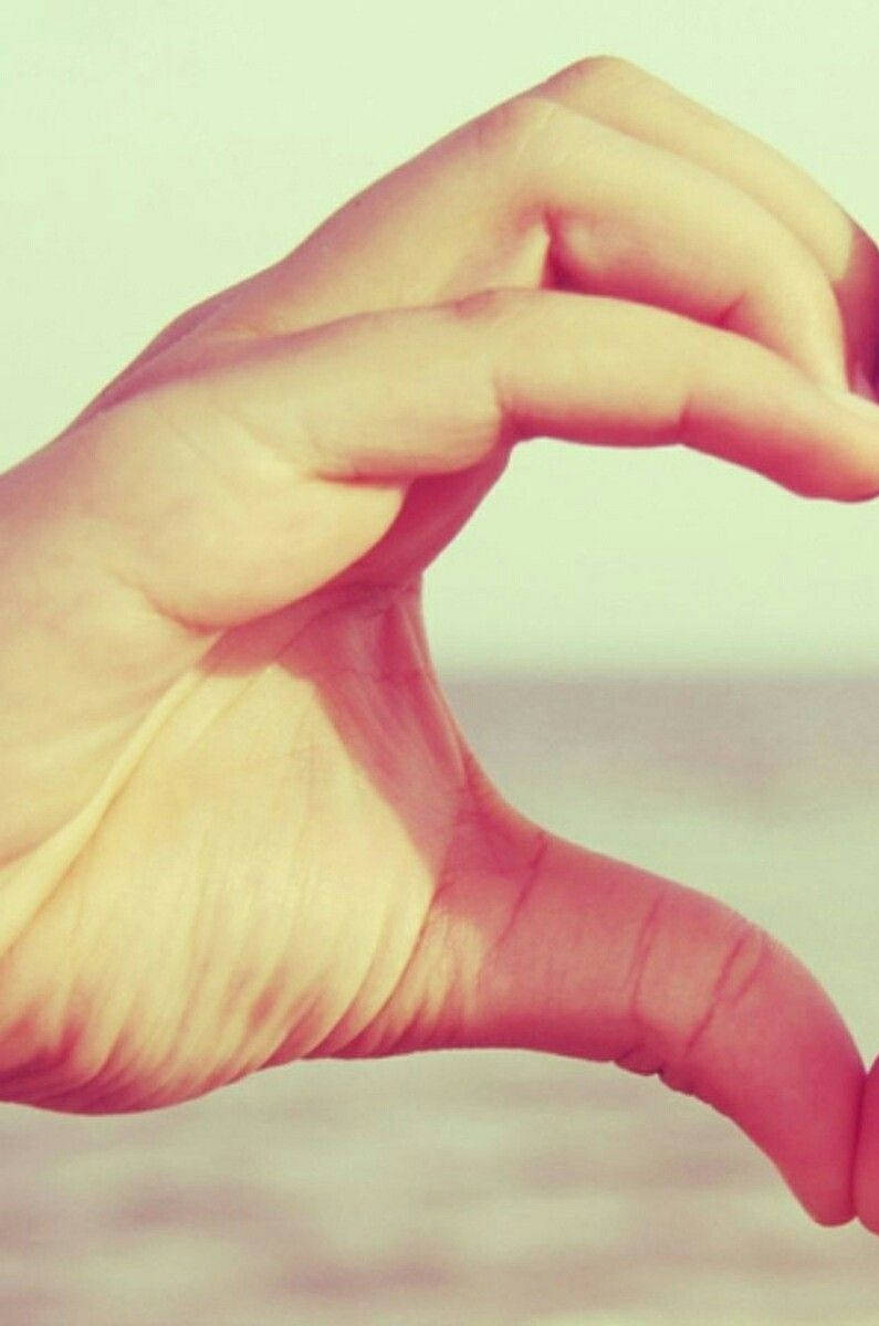 Cute Couple Matching Left Hand Heart Sign Wallpaper