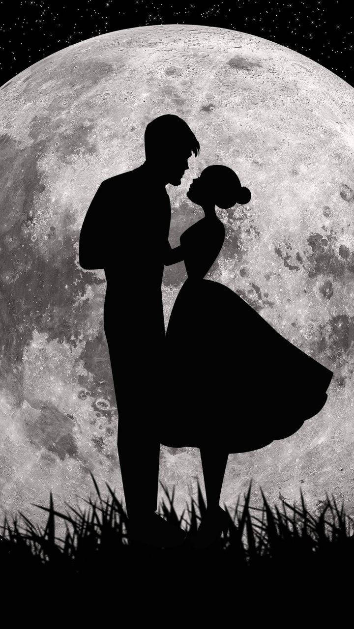 Cute Couple Silhouette In Front Of Moon Wallpaper