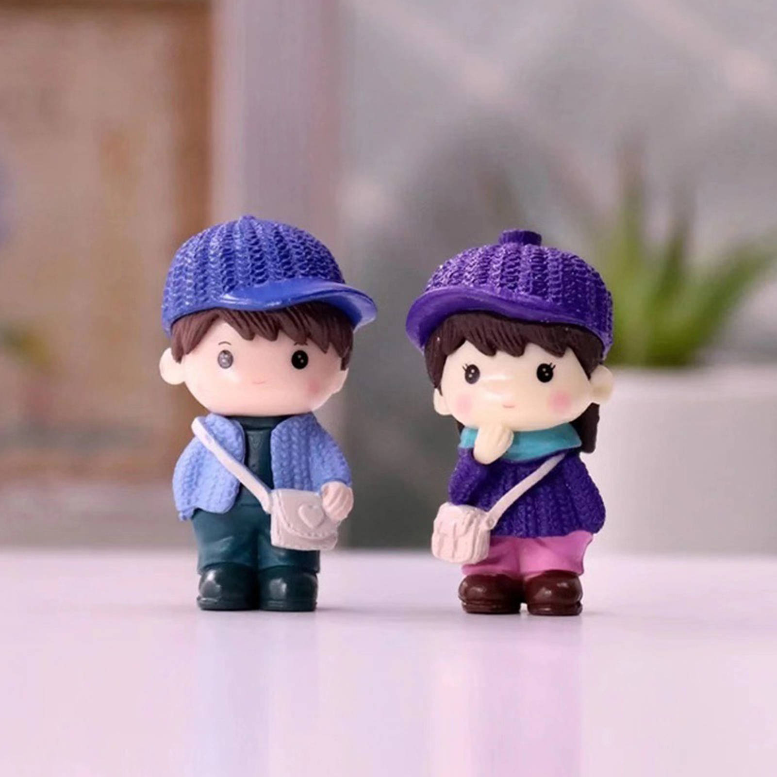 Cute Doll Couple With Purple Hats Wallpaper