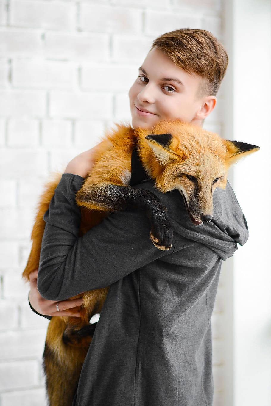 Cute Tomboy Holding A Fox Wallpaper