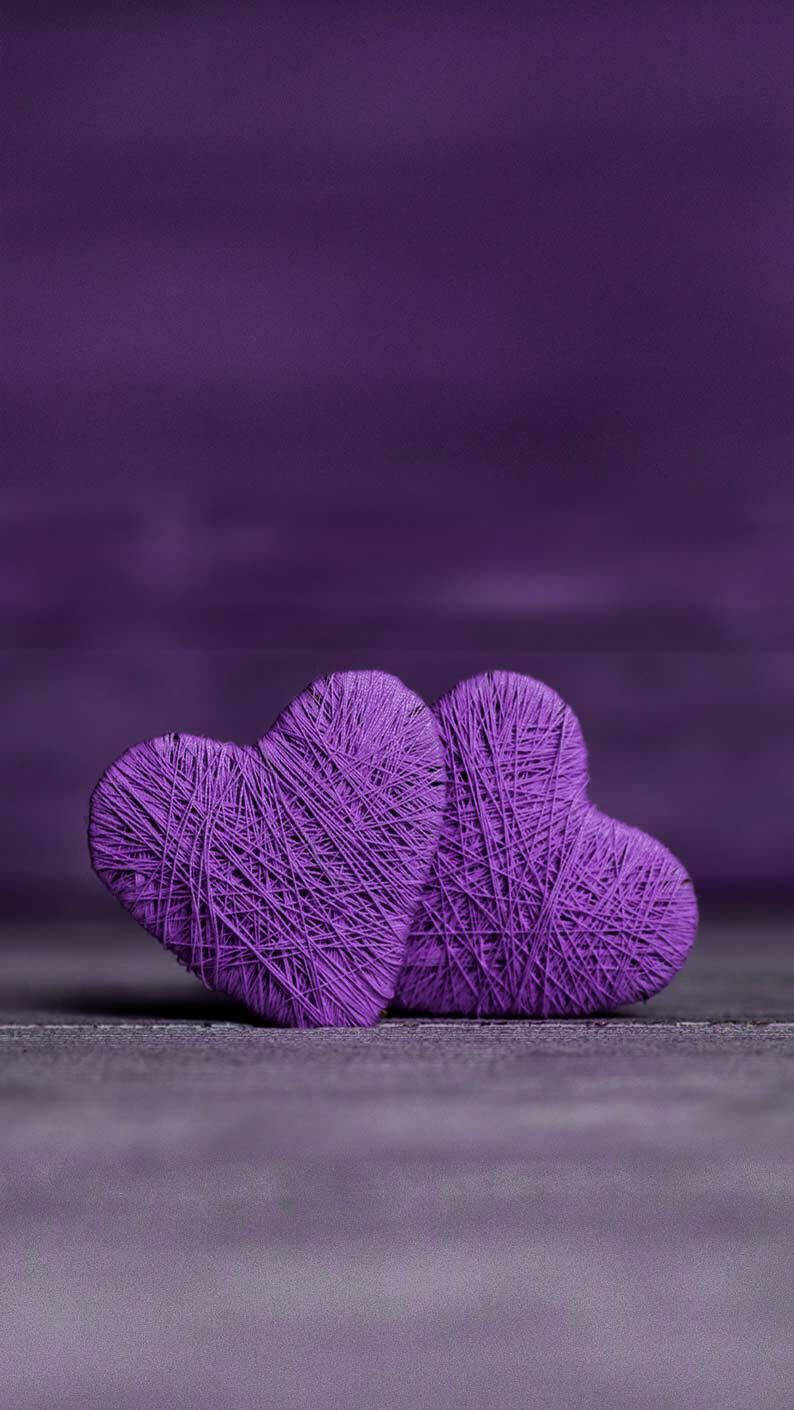 Cute Two Purple Yarn Hearts Wallpaper