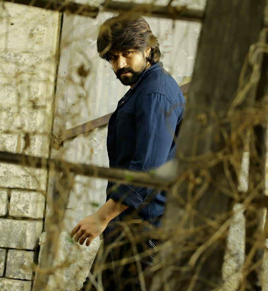 Daring And Defiant - Rocking Star Yash Among Barbed Wires Wallpaper