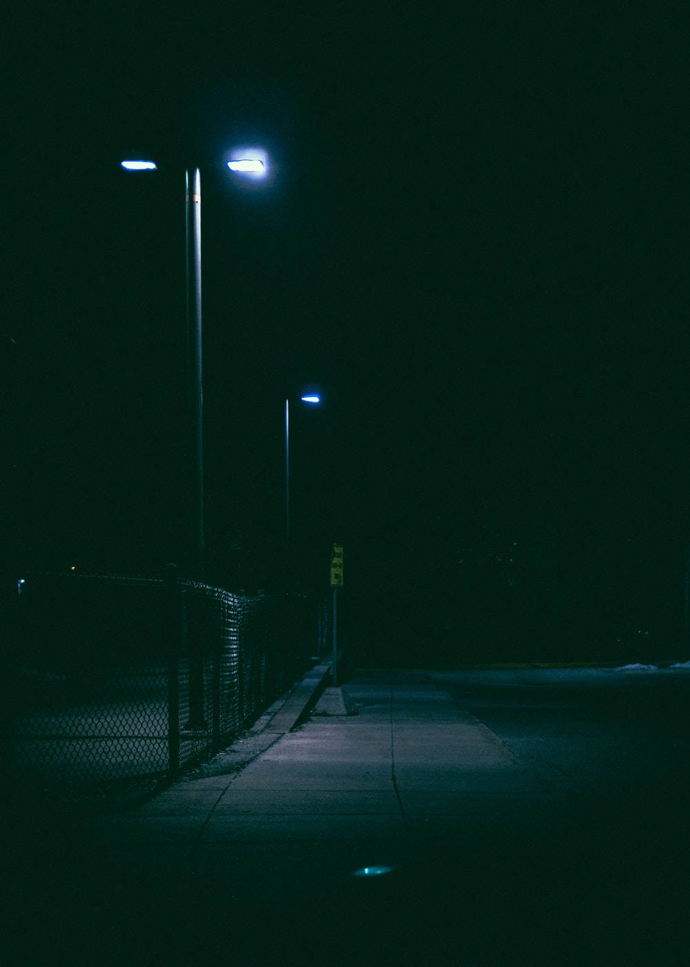 Dark Night Sidewalk With Light Wallpaper