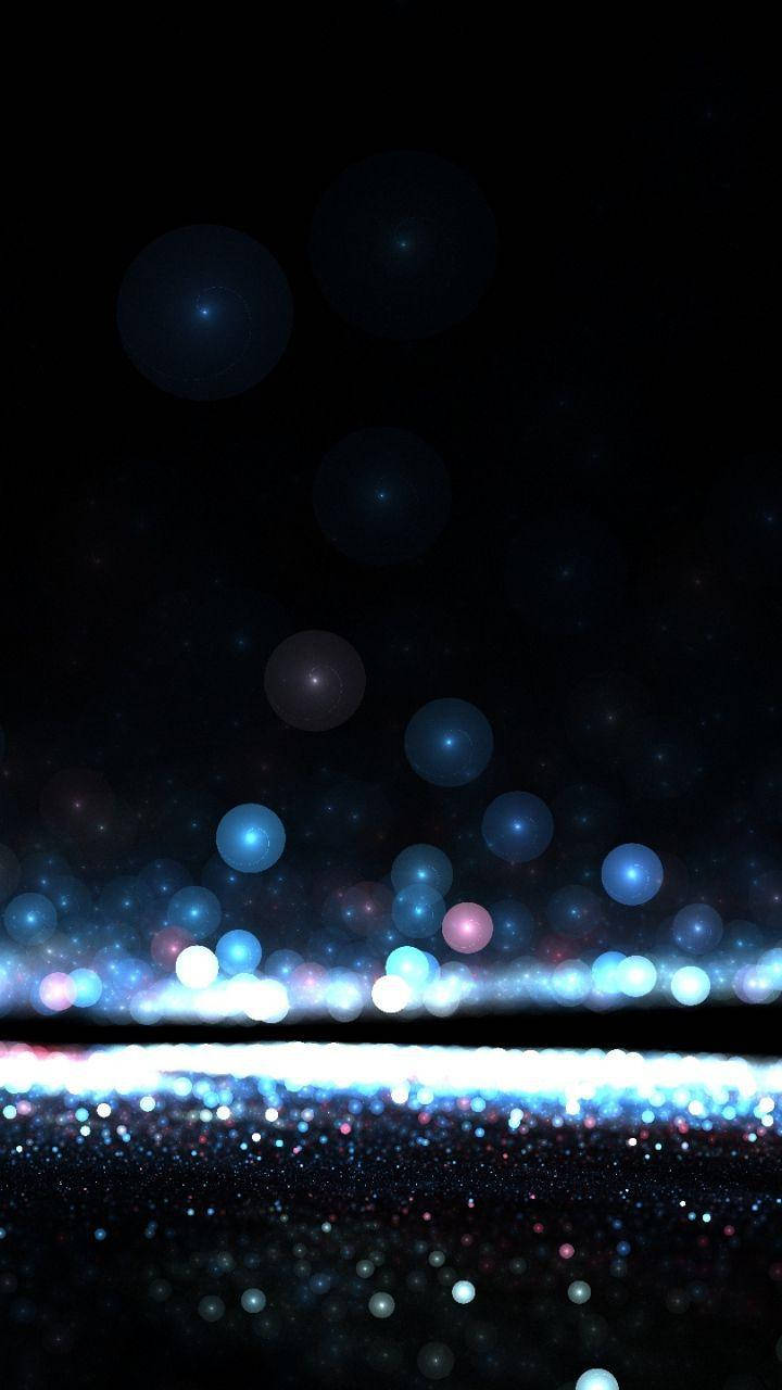 Dark Phone With Glowing Blue Orbs Wallpaper