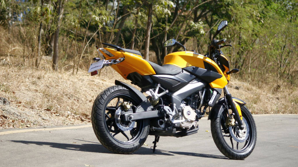 Dazzling Speed - Pulsar Rs200 In Bright Yellow Wallpaper