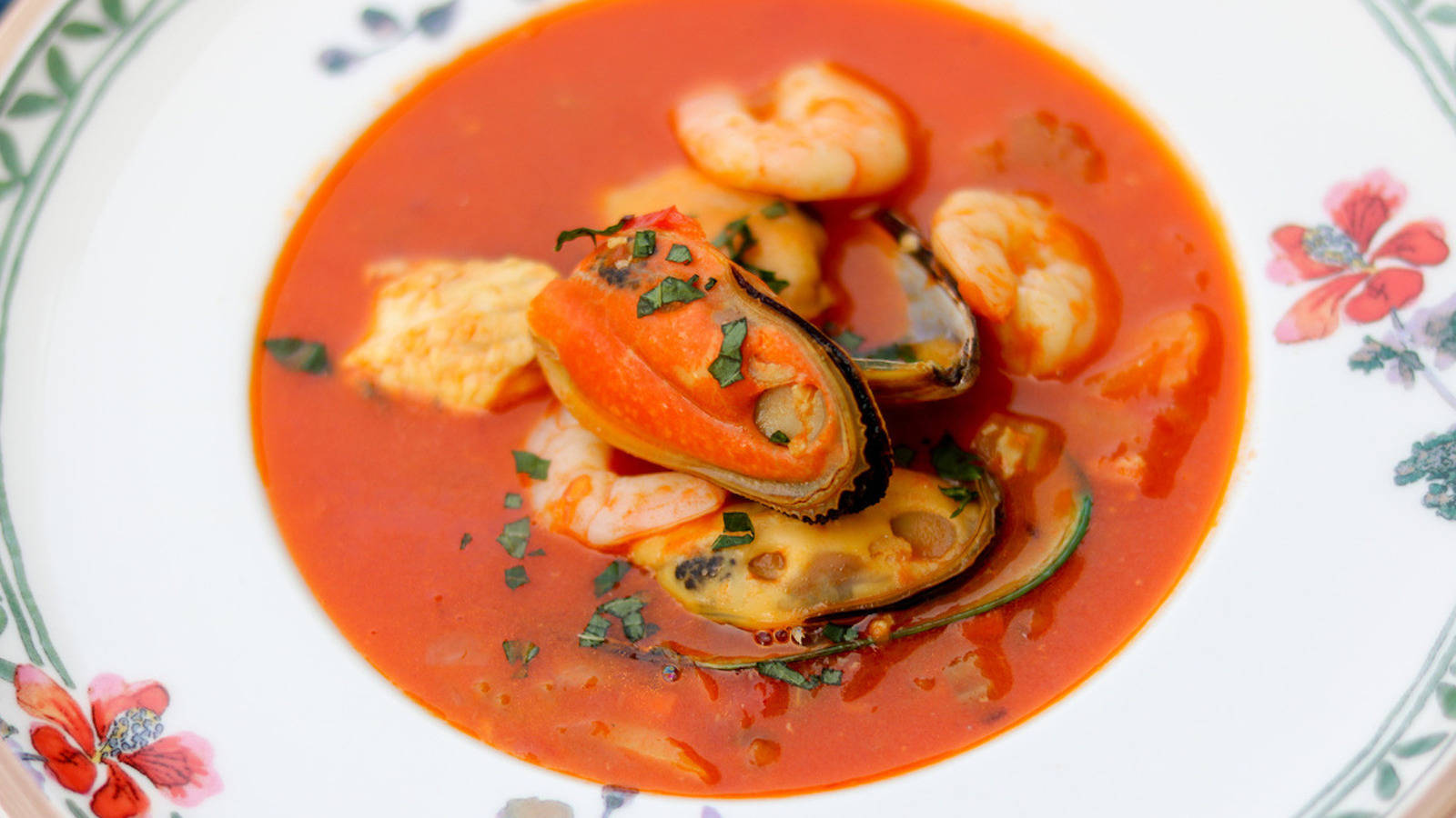 Delectable French Bouillabaisse Served In Floral Plate Wallpaper