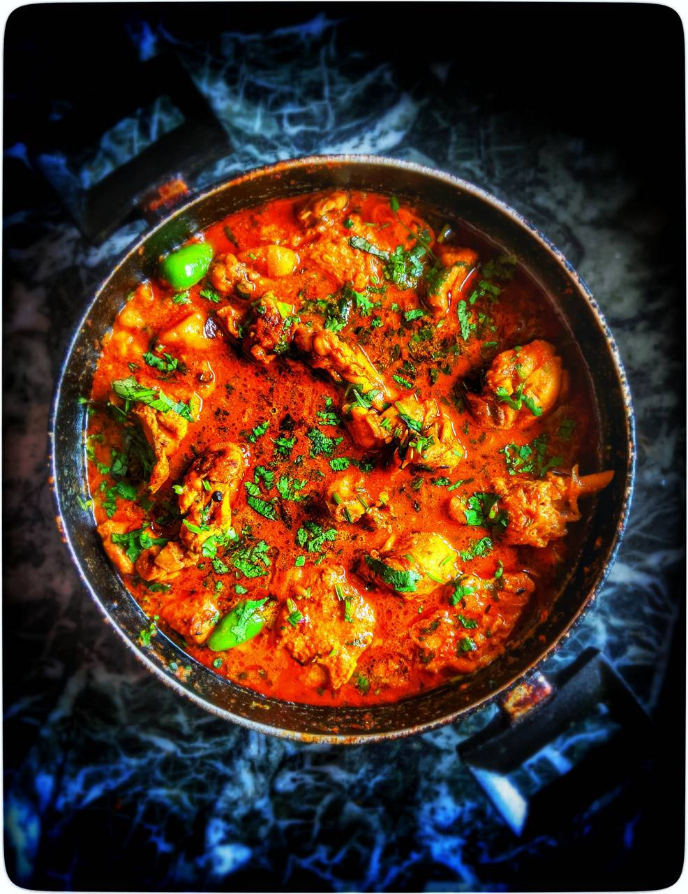 Delightful Butter Chicken Garnished With Fresh Herbs Wallpaper