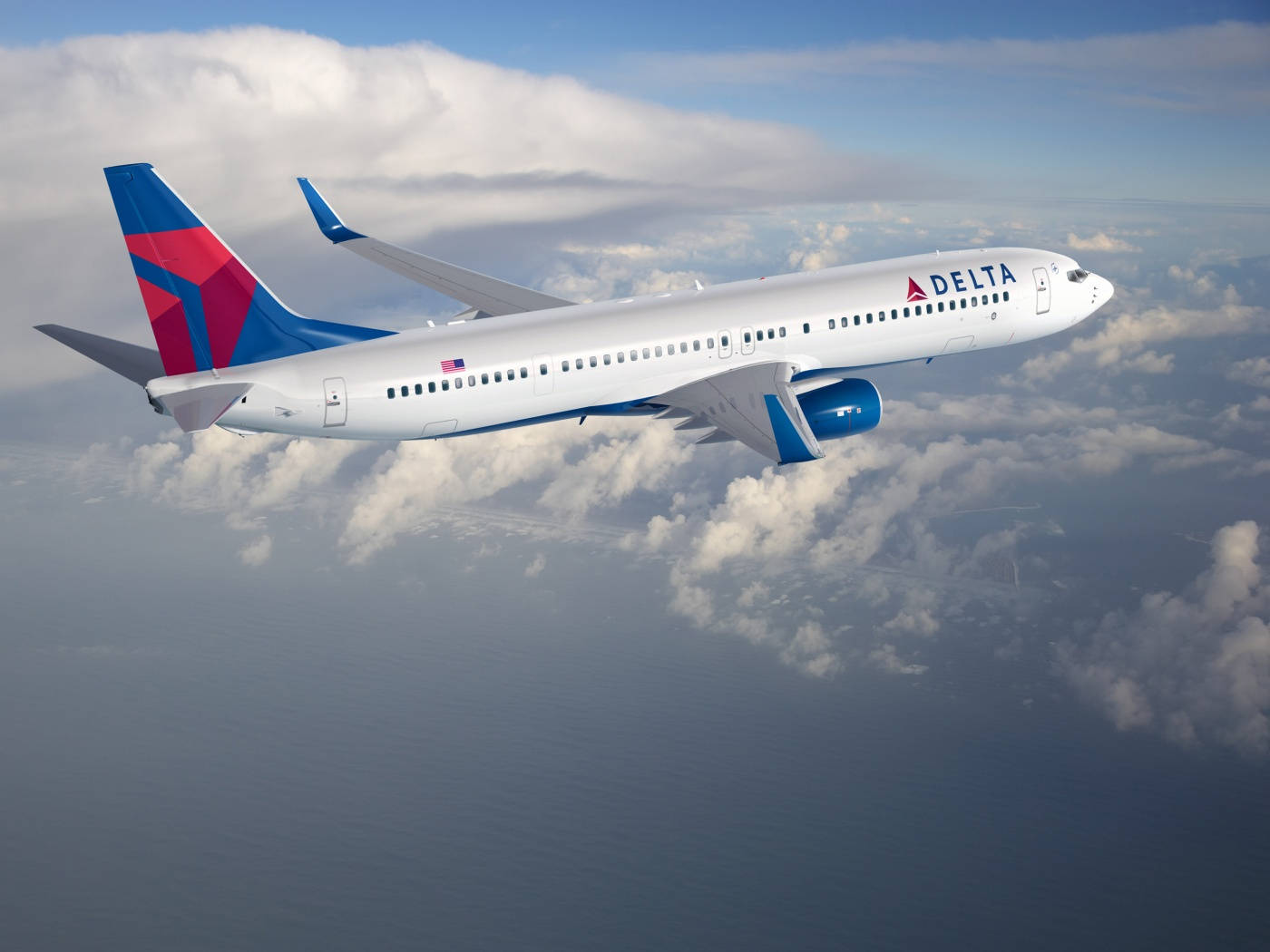 Delta Airlines Airplane Flying Above The Clouds Wallpaper