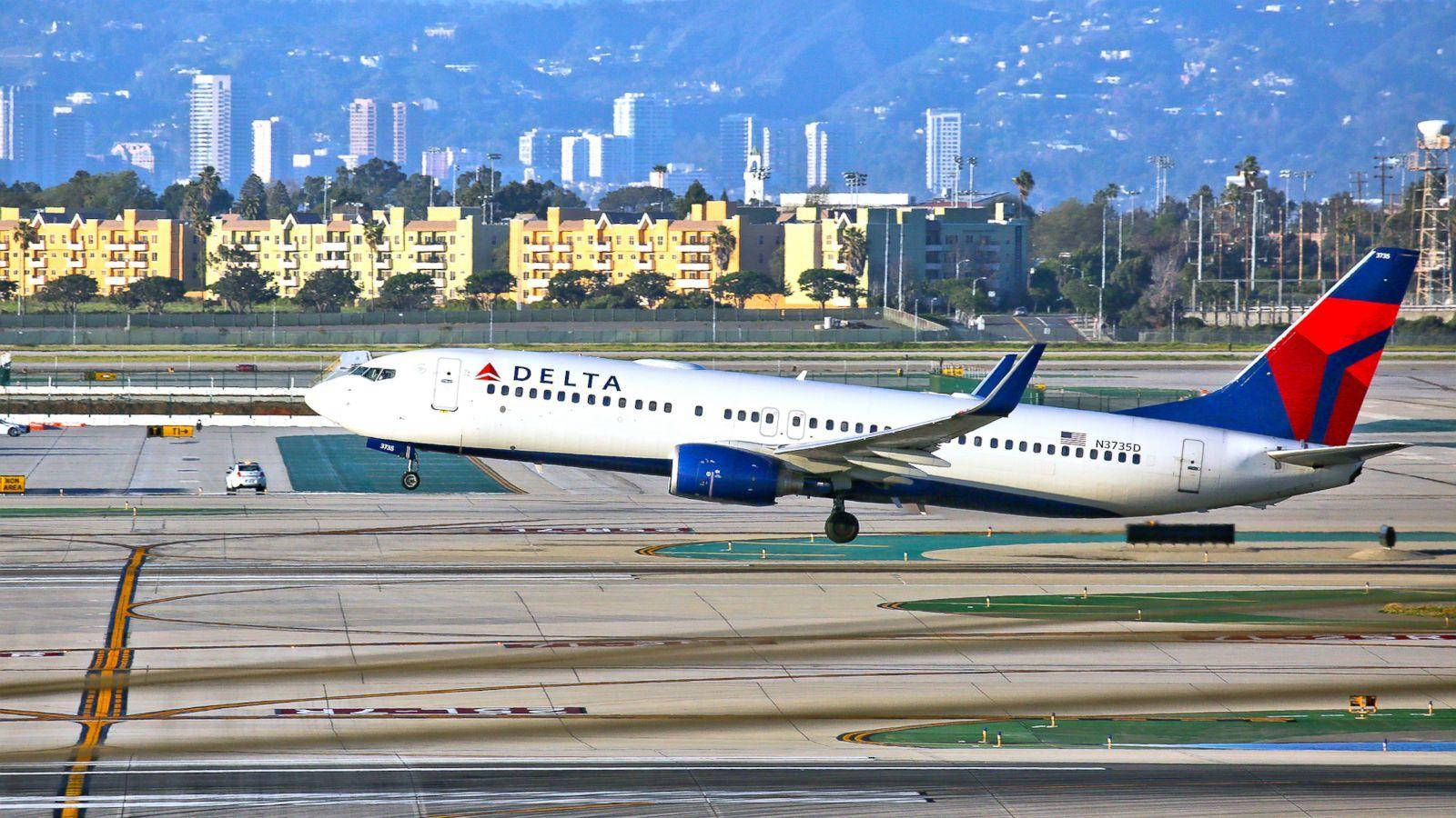 Delta Airlines Airplane On Airport Runway Wallpaper