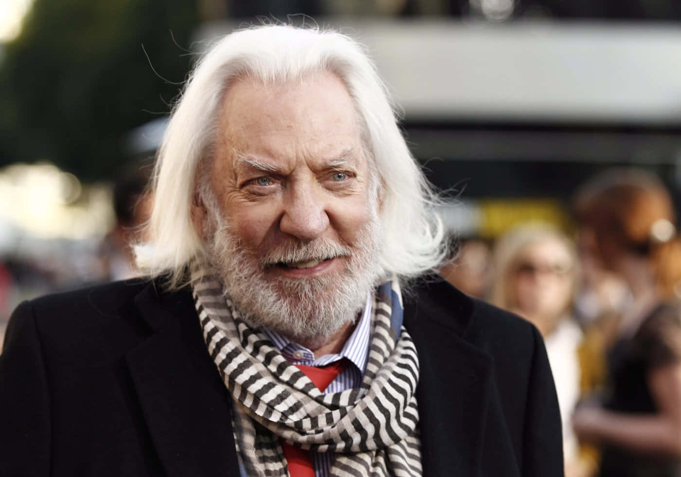 Donald Sutherland Smilingwith Scarf Wallpaper