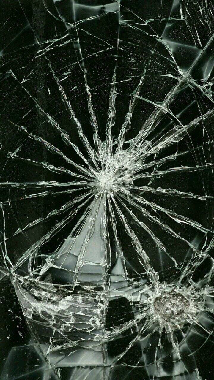 Dramatic Shattered Glass On A Dark Backdrop Wallpaper