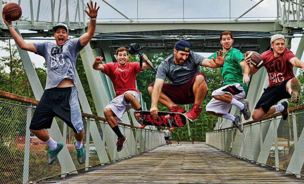 Dude Perfect Team Leaping Off A Bridge Wallpaper