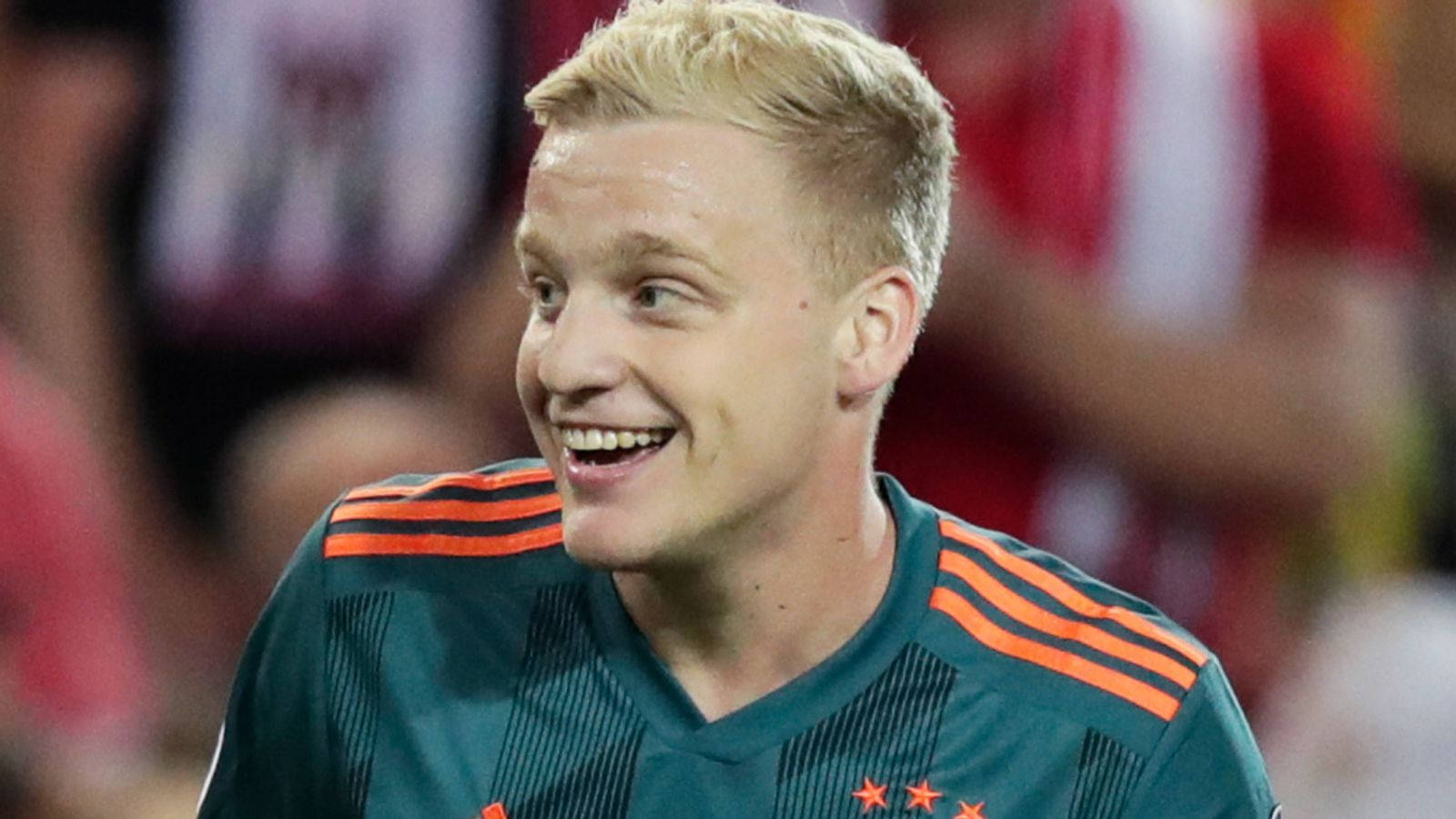 Dutch Football Star Donny Van De Beek Giving A Bright Smile. Wallpaper