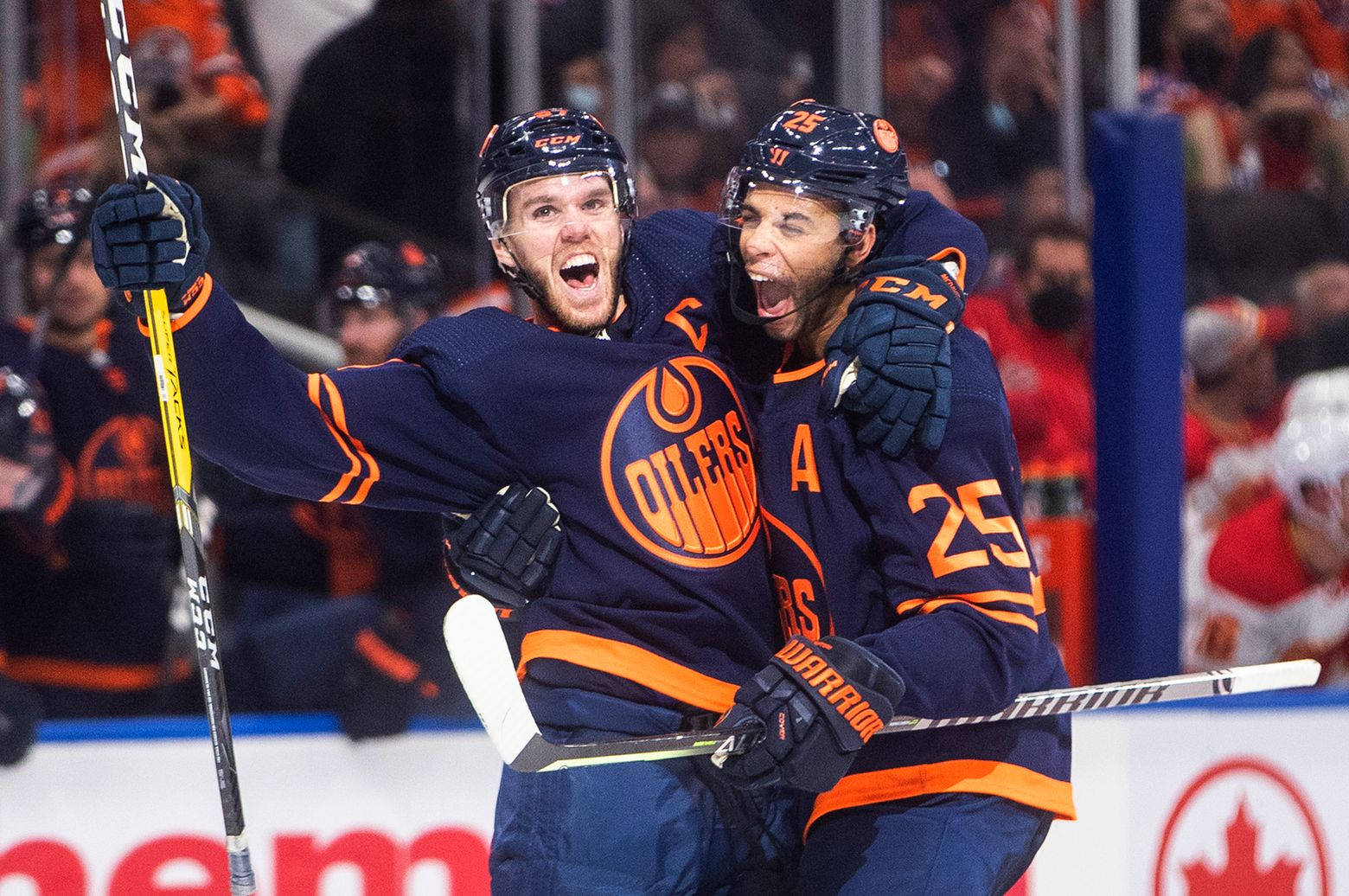 Edmonton Oilers Connor Mcdavid And Darnell Nurse Against Calgary Flames Wallpaper