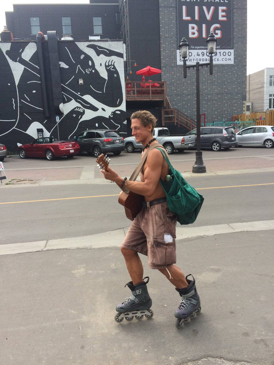 Edmonton Rollerblading Guitar Guy Wallpaper