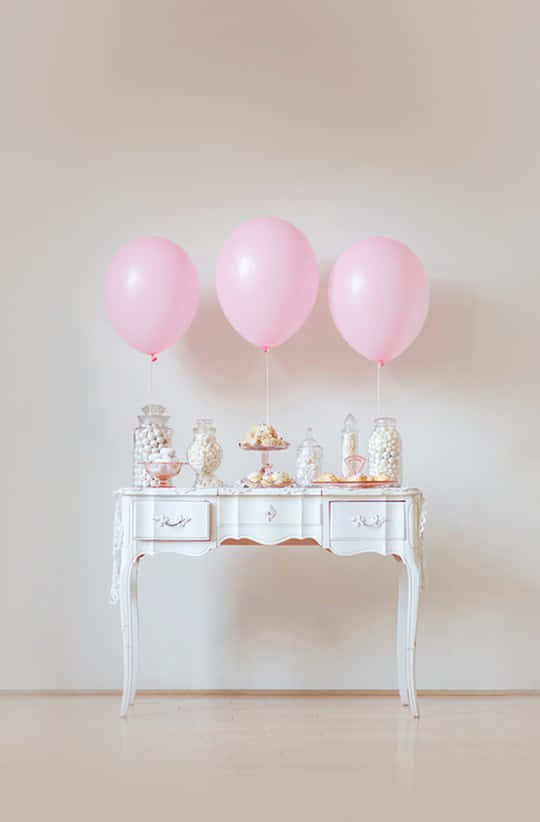 Elegant Pink Birthday Party Setup Wallpaper