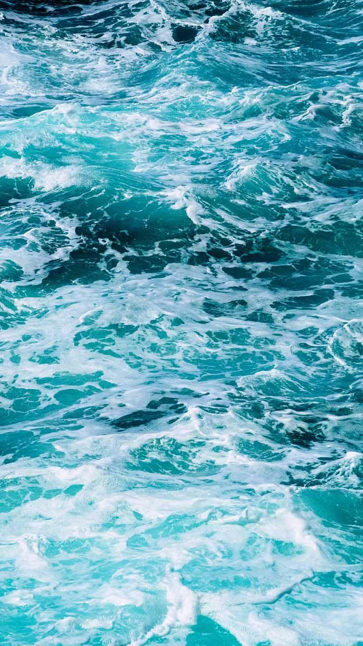 Embrace The Boldness Of The Turquoise Iphone. Wallpaper