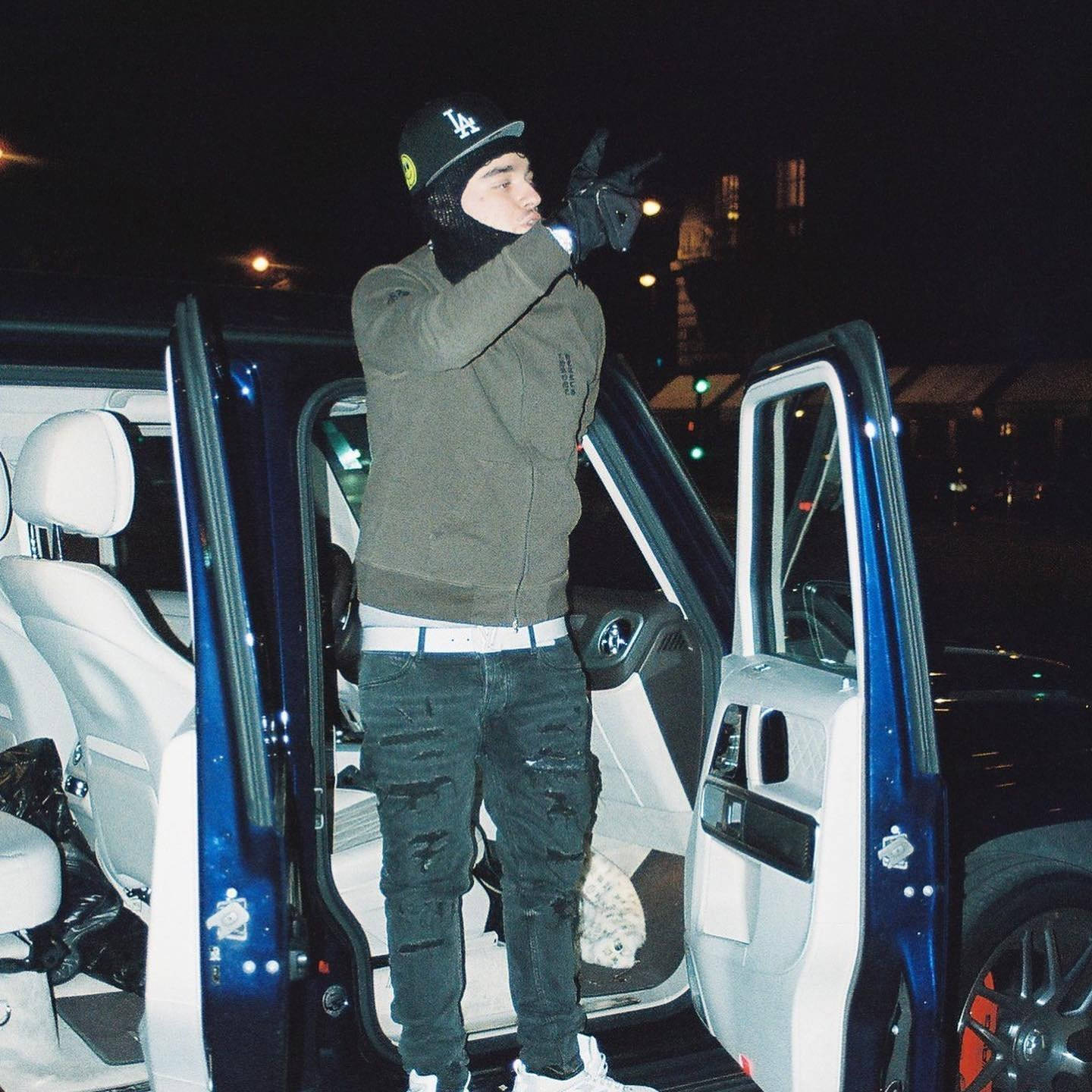 Emerging Rap Superstar Yeat Posing With His Luxury Car Wallpaper