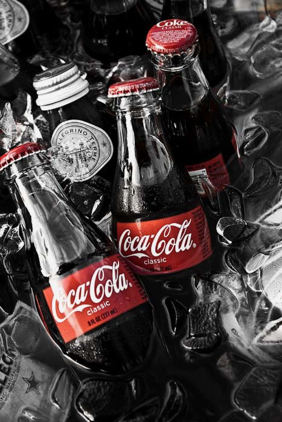 Enjoy An Ice-cold Coca-cola With Friends And Family! Wallpaper