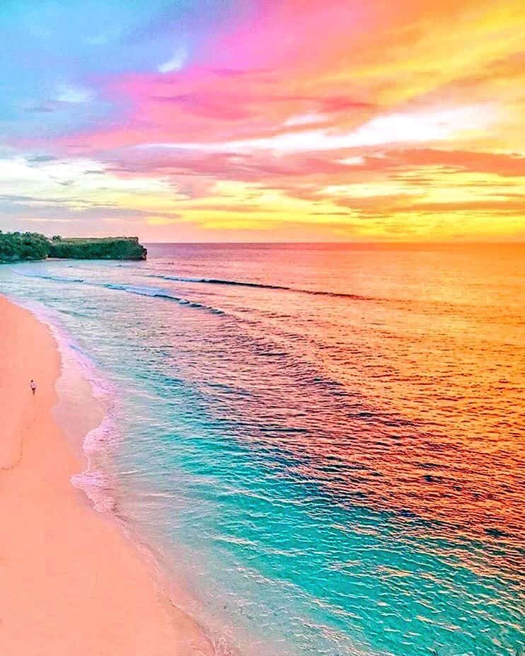 Enjoying The Breathtaking View Of The Pastel Beach. Wallpaper