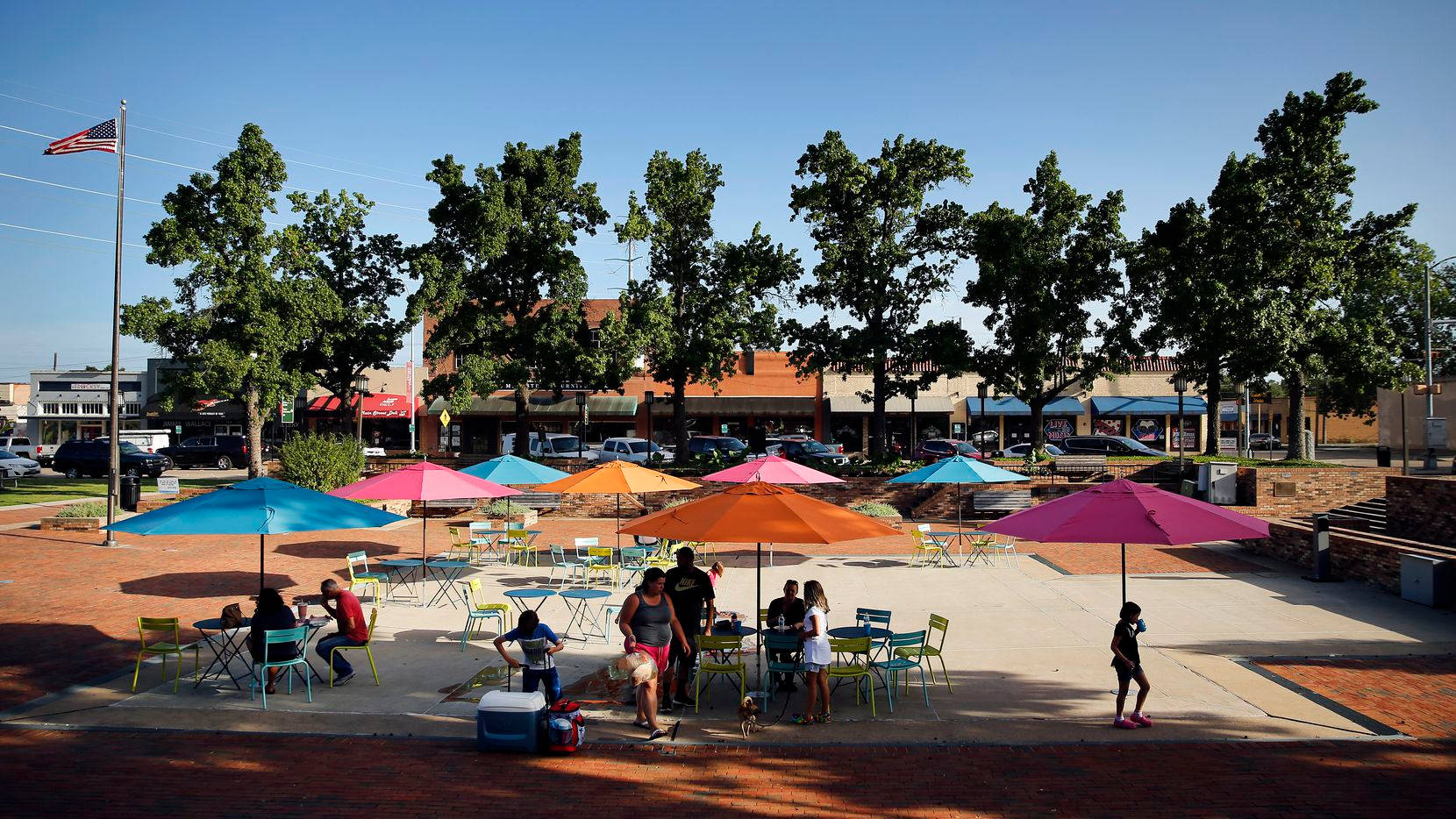 Enjoying The Sunlight In Downtown Garland Square Wallpaper