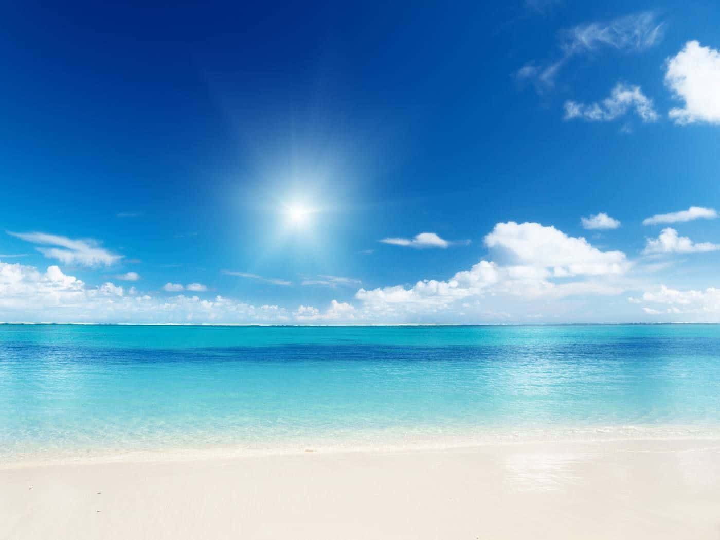 Enjoying The Sunset On A Caribbean Beach Wallpaper