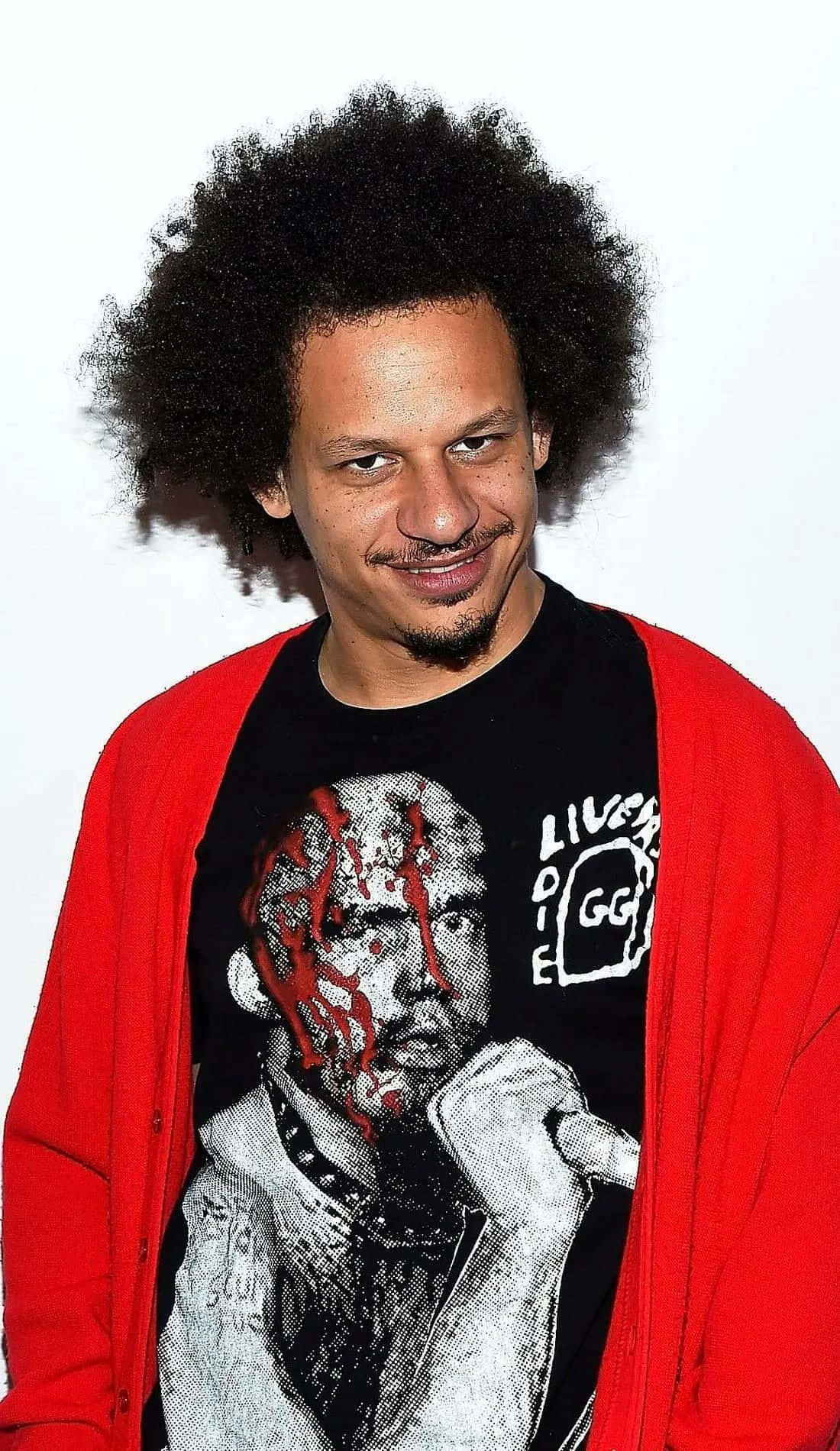 Eric Andre Red Cardigan Smirk Wallpaper