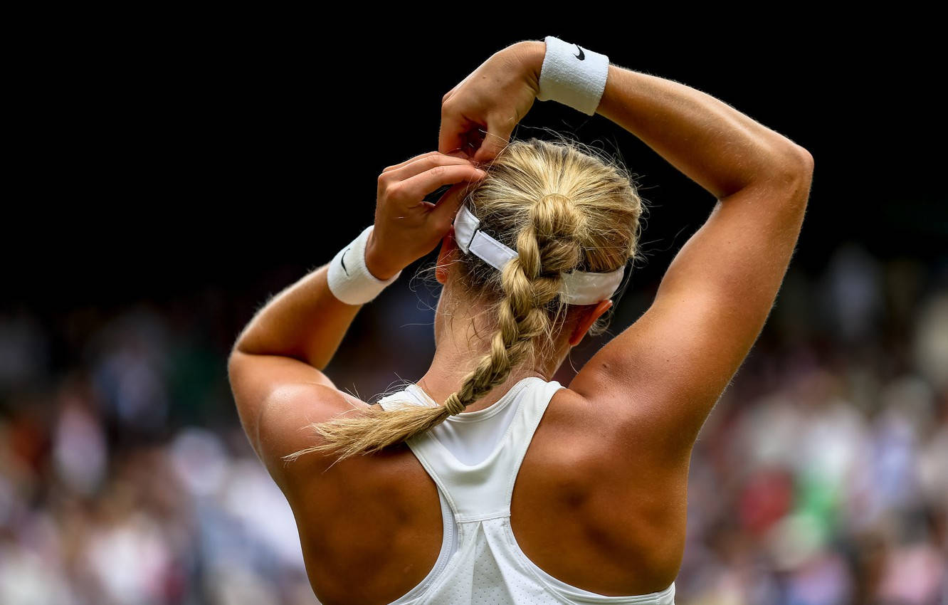 Eugenie Bouchard Adjusting Her Hair On The Court Wallpaper