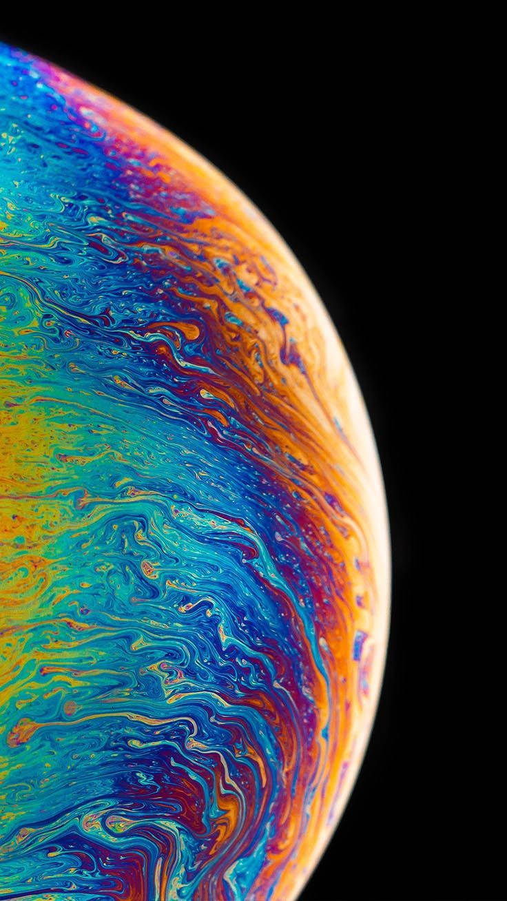 Experience An Out Of This World Landscape With Iphone Xs Planet Wallpaper