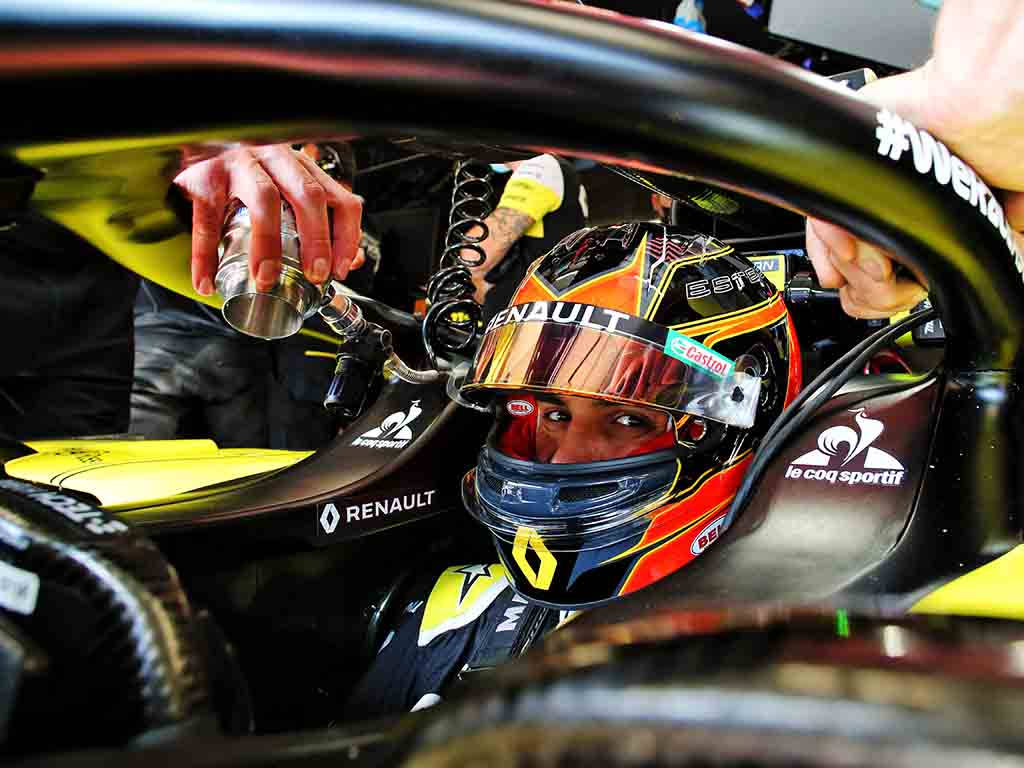 F1 Driver Esteban Ocon Racing In Full Throttle Wallpaper