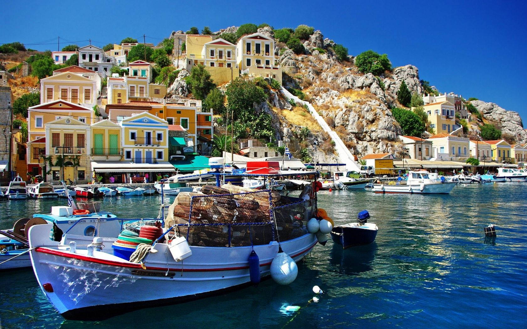 Floating Boat In Simi Greece Wallpaper