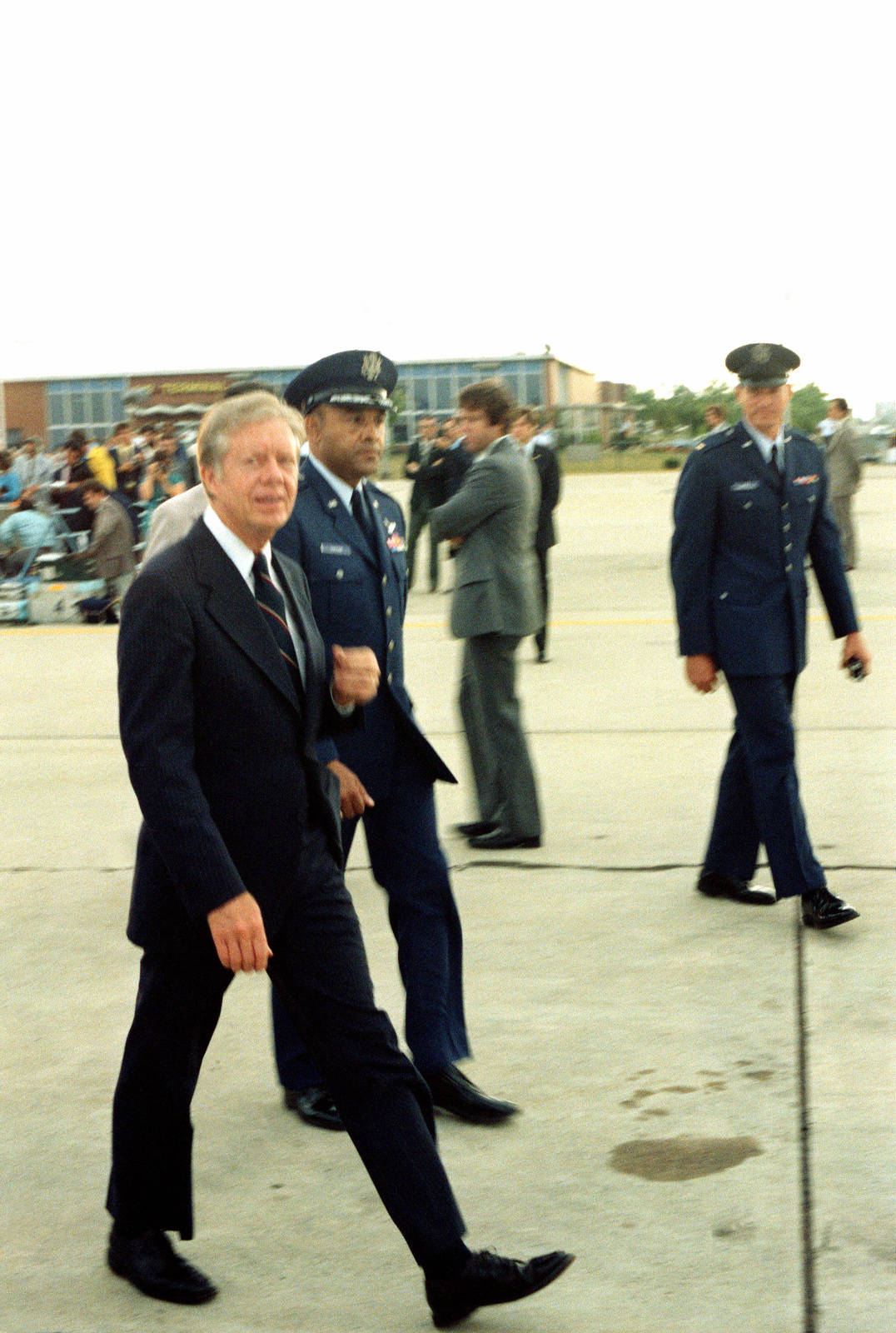 Former President Jimmy Carter Stands Proudly With The Military Force. Wallpaper