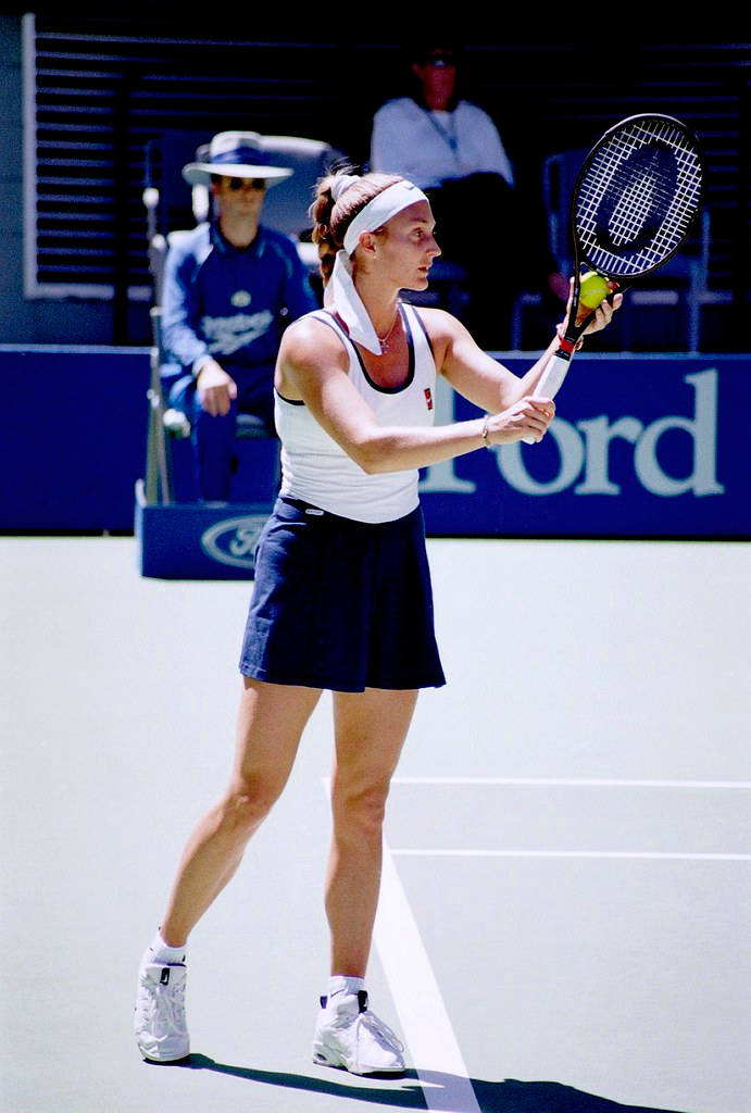 Former Tennis Star Mary Pierce Competing In White And Blue Dress Wallpaper