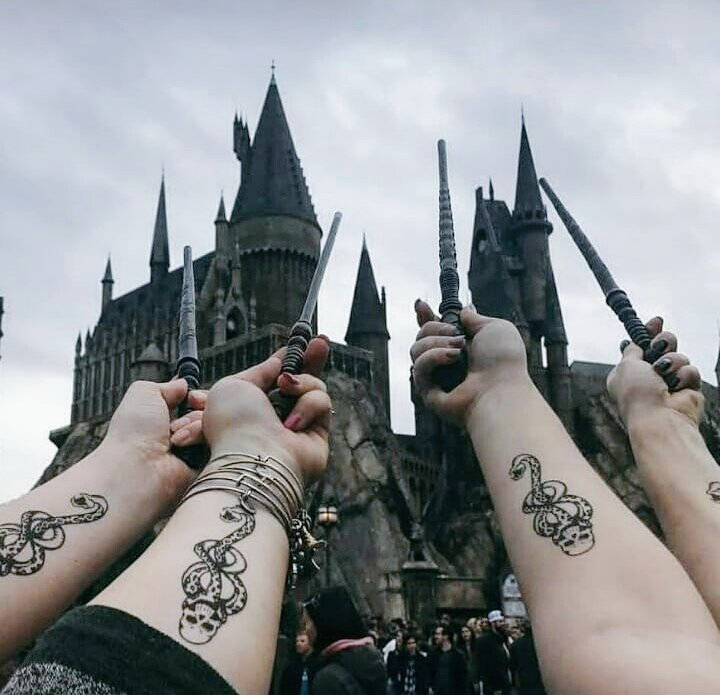 Four Arms With Slytherin Tattoo Hp Aesthetic Wallpaper