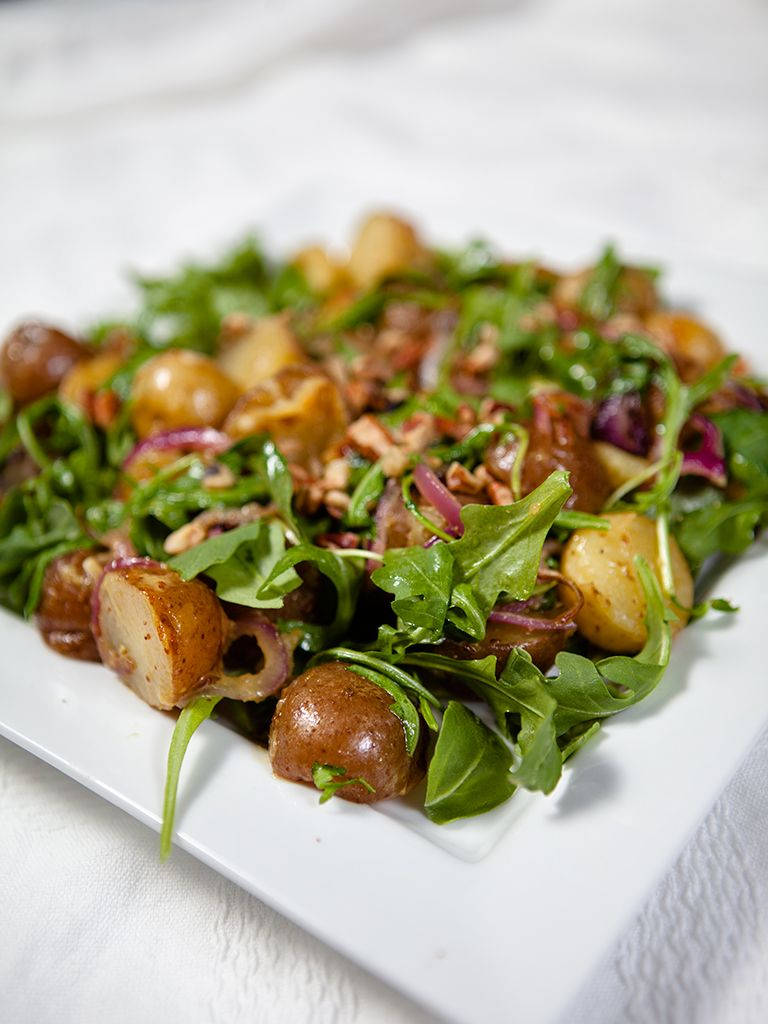 Fresh Arugula Leaves And Potato Salad Wallpaper