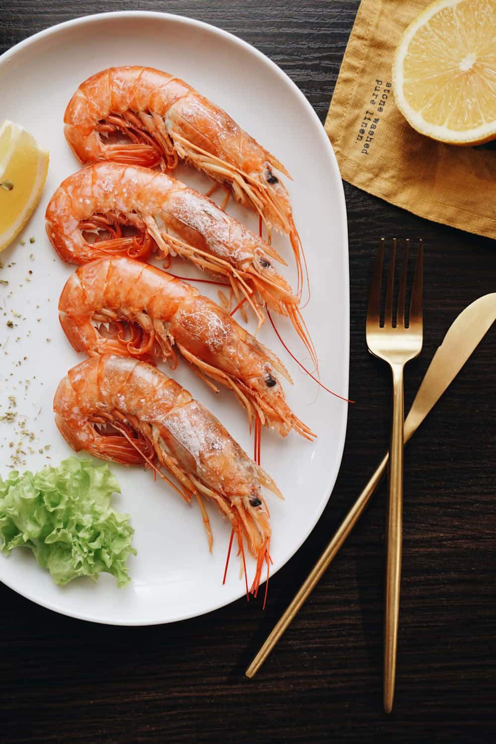 Fresh Prawns Plated With Lemon And Greens Wallpaper