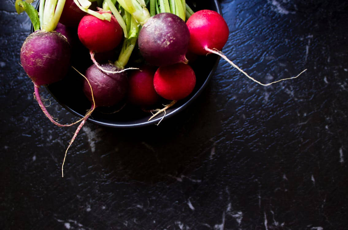 Fresh Radishes In A Rustic Bowl: A Celebration Of Healthy Eating Wallpaper