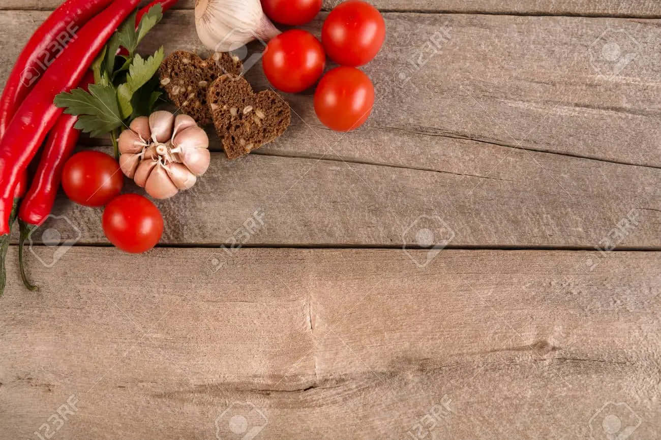 Fresh Tomatoes, Garlic, Chili Peppers And Herbs On A Wooden Background Wallpaper