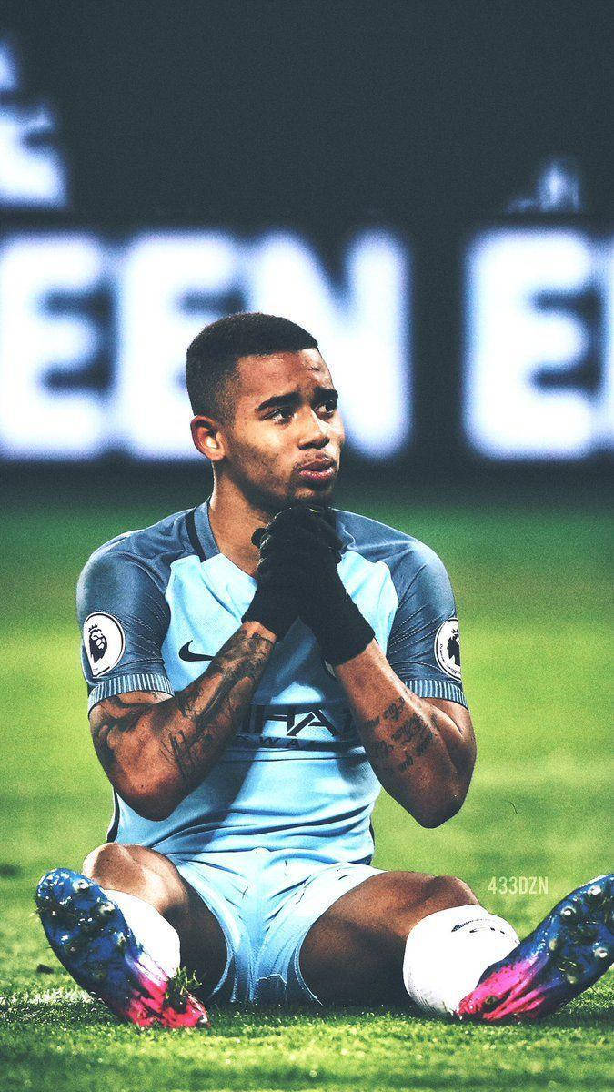 Gabriel Jesus Sits Down Hands Together Wallpaper