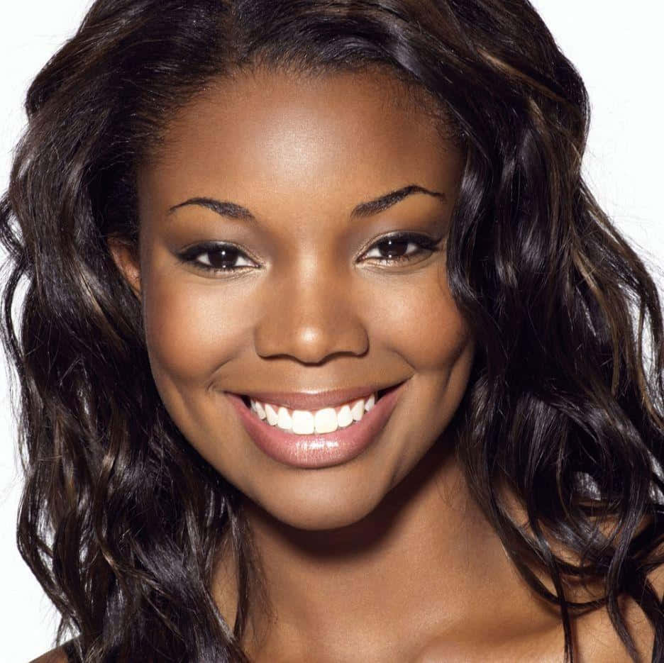 Gabrielle Union Smiling Radiantly In A Black Off-shoulder Outfit Wallpaper
