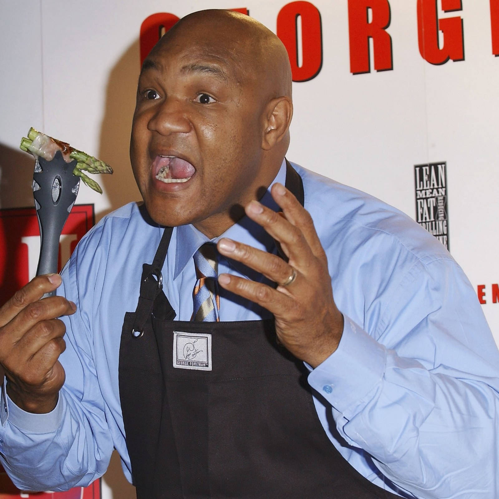 George Foreman Wearing Apron Wallpaper