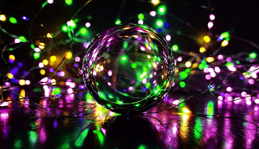 Glowing Disco Ballwith Colorful Lights Wallpaper