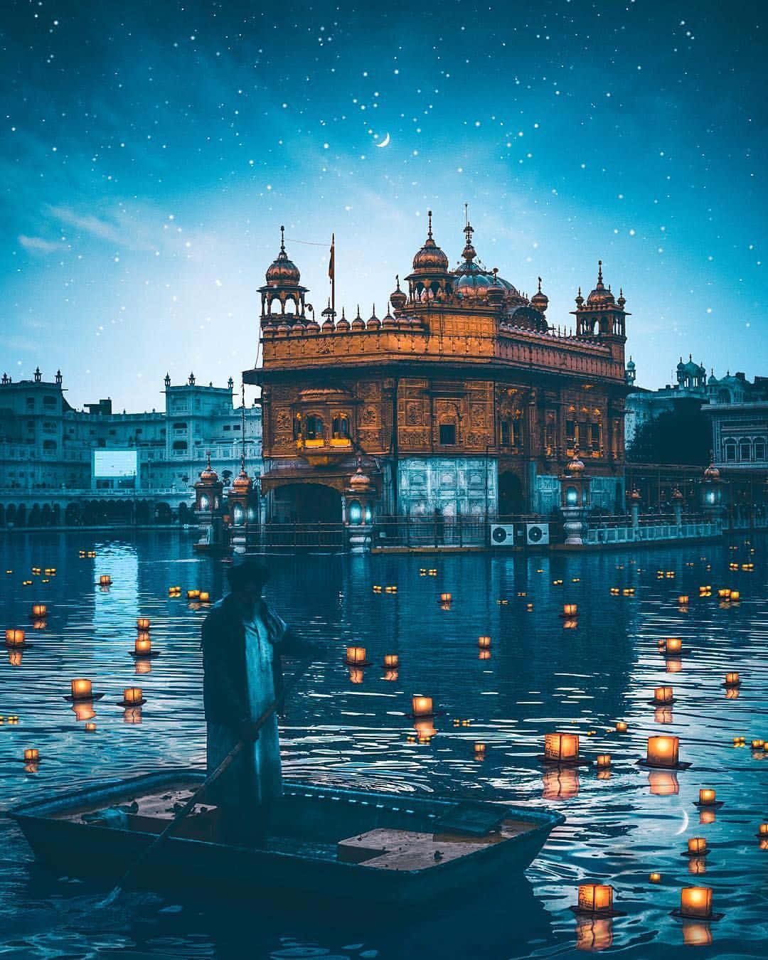 Golden Temple With Floating Candles Wallpaper