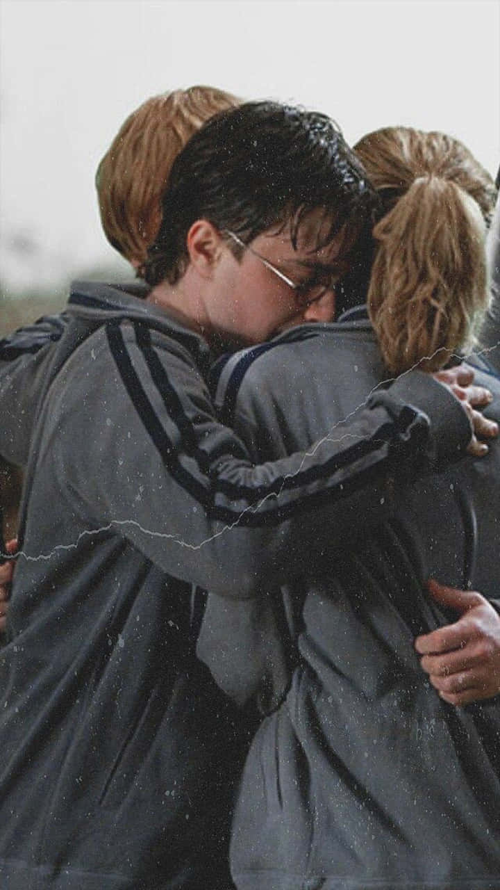 Golden Trio Hugging Phone Wallpaper