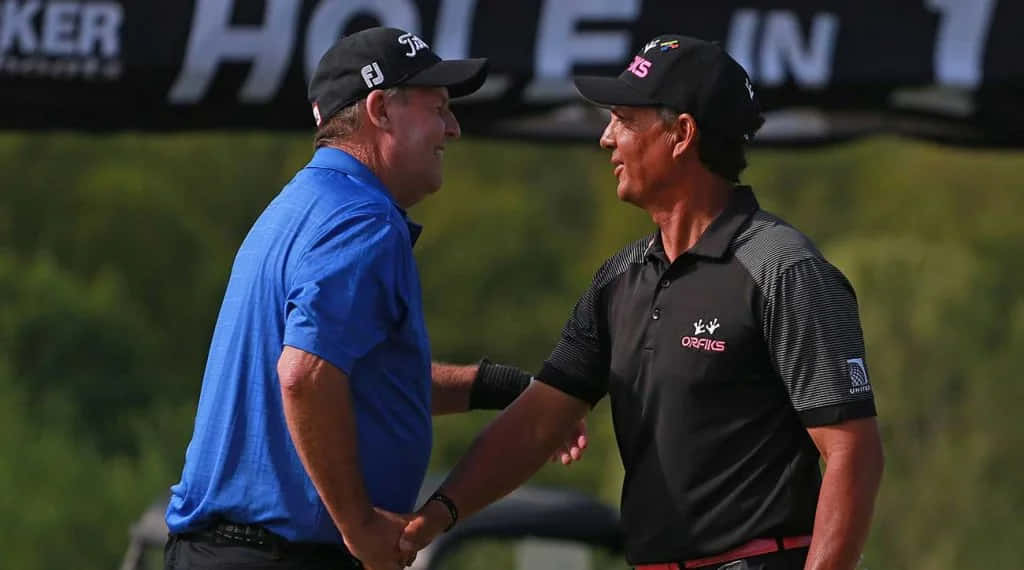 Golfers Handshakeat Tournament Wallpaper
