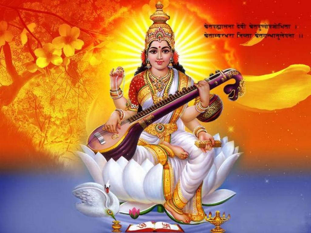 Graceful Saraswati Devi - The Goddess Of Knowledge And Art Wallpaper