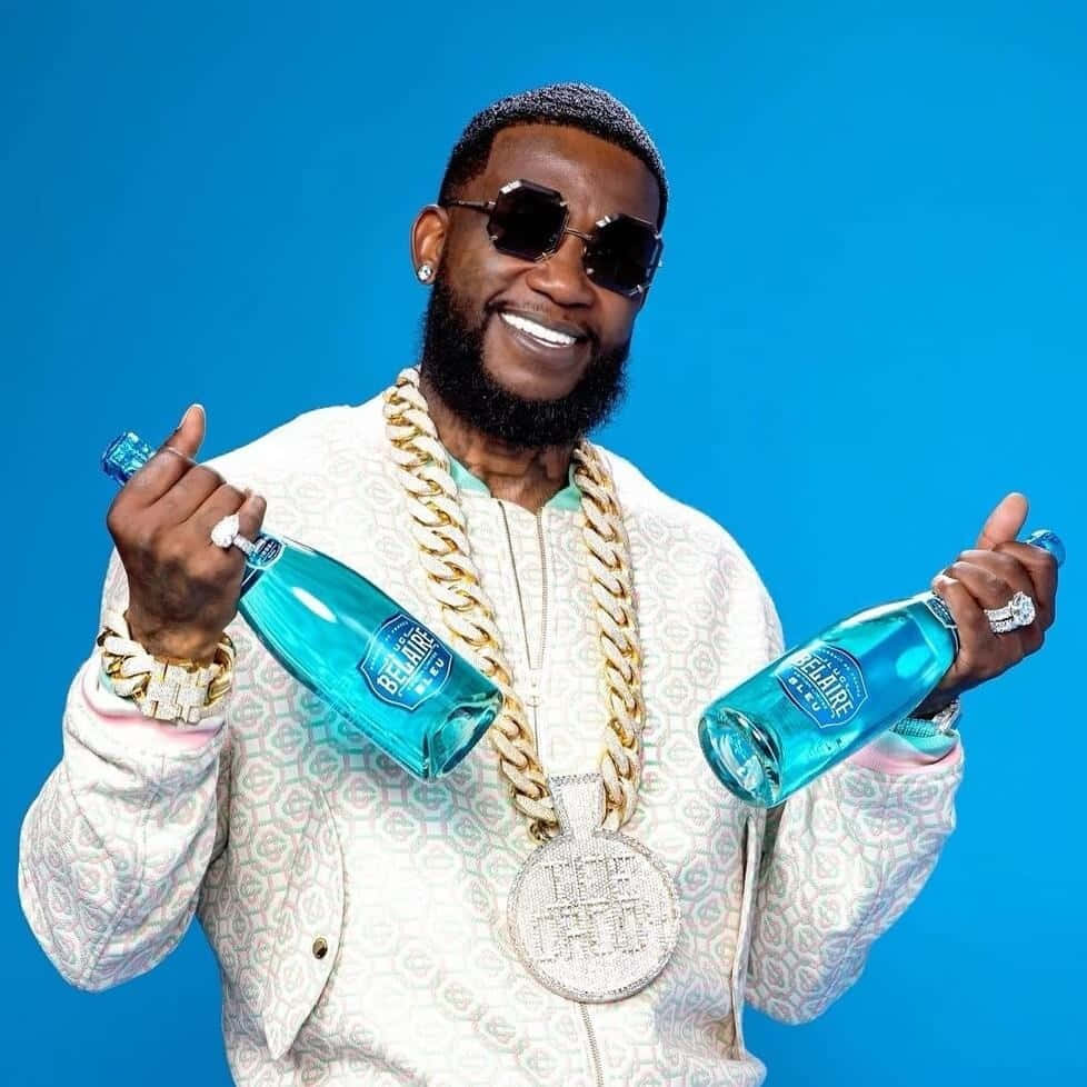 Gucci Mane Promoting Bel Air Blue Bottles Wallpaper