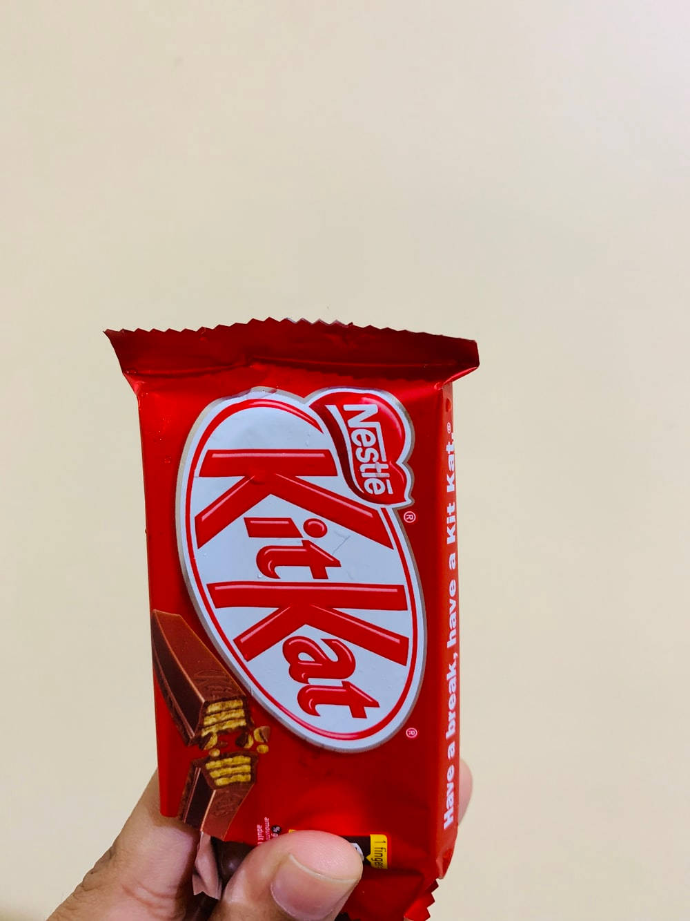 Hand Holding A Kit Kat Wallpaper