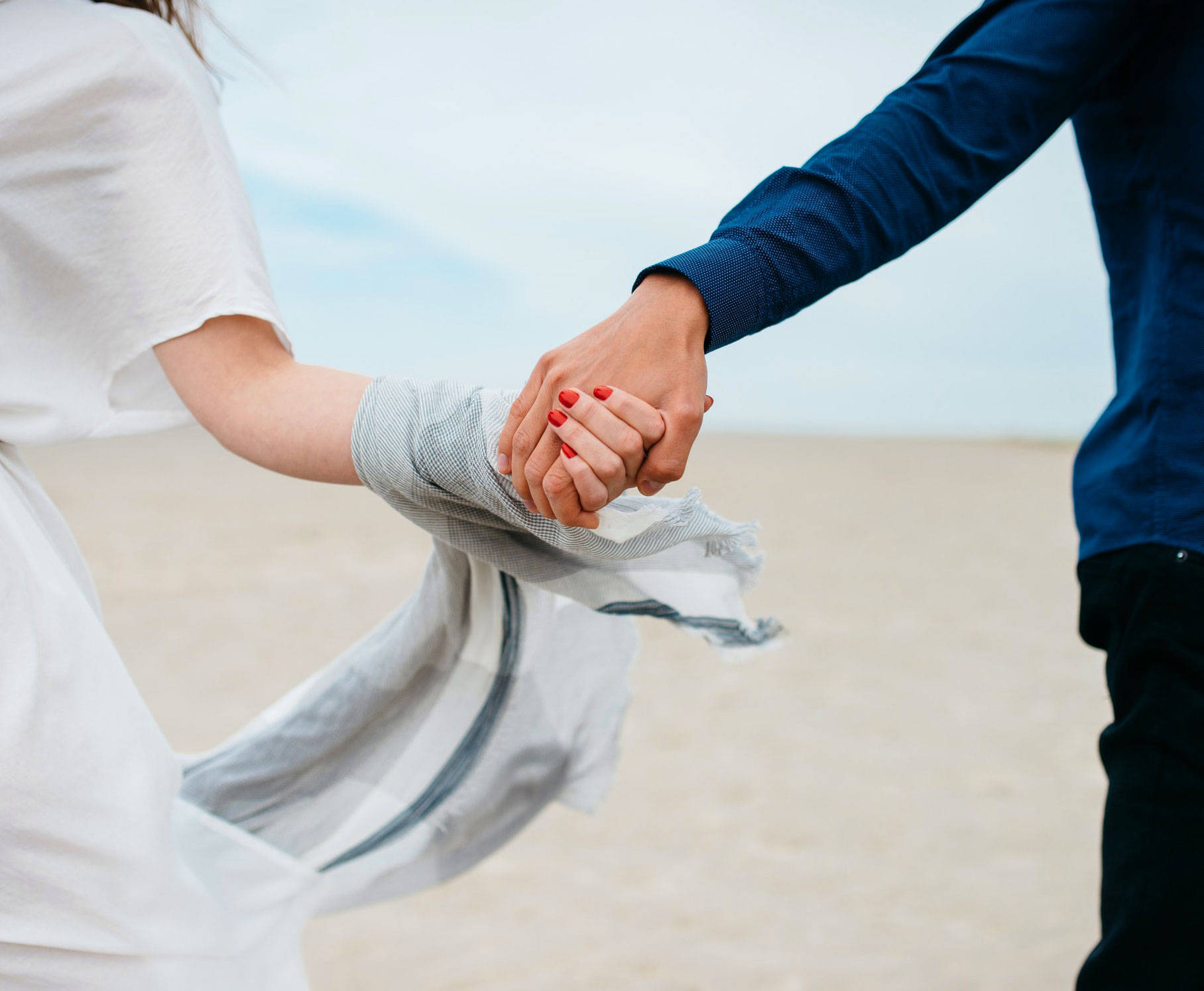 Hand In Hand Couple At The Beach Wallpaper